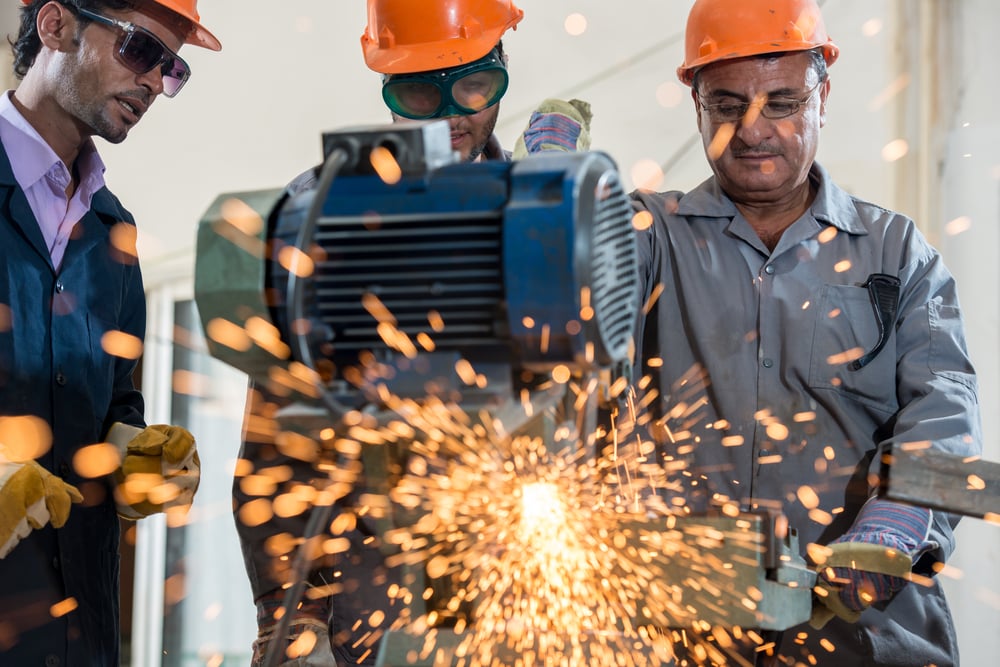 Industrial background. Welder in a factory Industrial background. Welder in a factory